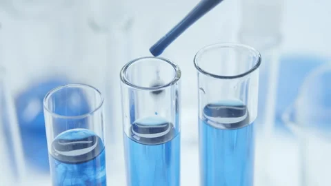 Mixing with water in a test tubes. Stock Footage 248222133