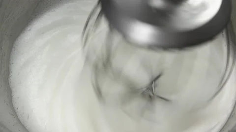 Mixing white egg cream in iron bowl Stock Footage 62425527