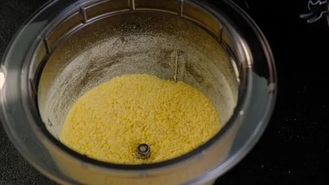 Mixing Yellow Granules in Food Processor at Cooking Stock Footage 341453356