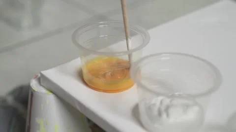 Mixing Yellow Paint Stock Footage 139265805