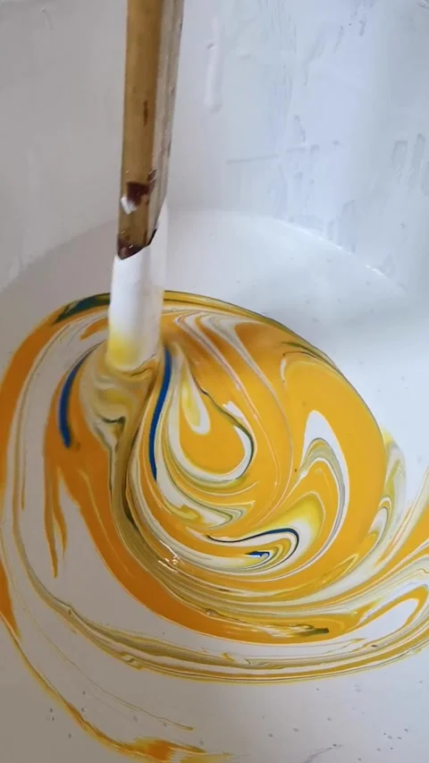 Mixing yellow white blue paint for painting walls in the apartment. House p.. Video stock 278523948