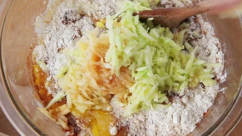 Mixing zucchini apple bread batter Stock Footage 93001567