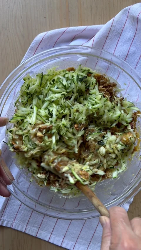 Mixing zucchini cake batter vertical Stock Footage 247663831