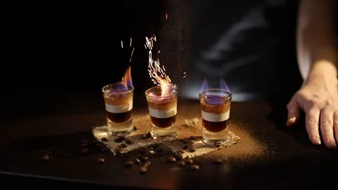 Mixologist making B 52 cocktail Stock Footage 124585996