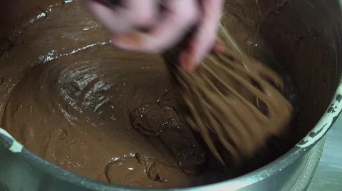 Mixture of chocolate and egg snow ingredients with a whisk Video stock 57910023