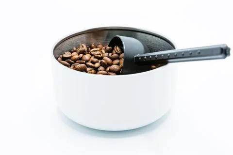Mixture of different kinds of roasted coffee beans with black plastic spoon i 스톡 사진