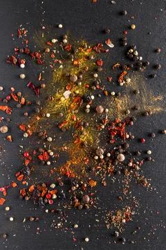 A mixture of different spices close up. Textures of colorful spices and condi Stock Photos