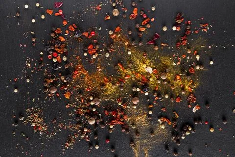 A mixture of different spices close up. Textures of colorful spices and condi Stock Photos