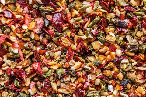 A mixture of different spices close up. Textures of colorful spices and condi Foto stock