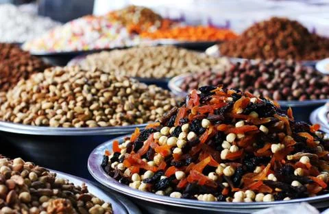 Mixture of dried apricots, prunes and hazelnuts. Dried fruits at east market Stock Photos