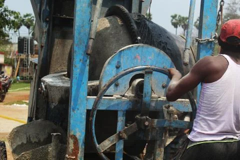 Mixture machine and operator working Stock Photos