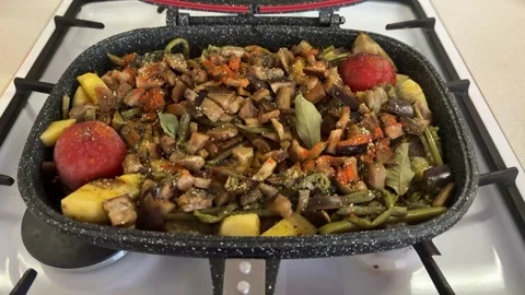 A mixture of meat and vegetables is cooking in a modern pressure cooker closed Stock Footage 301135835