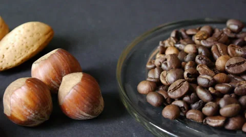Mixture of nuts and dried fruit with coffee beans and othe, walnuts, almonds, Stock Footage 33370439