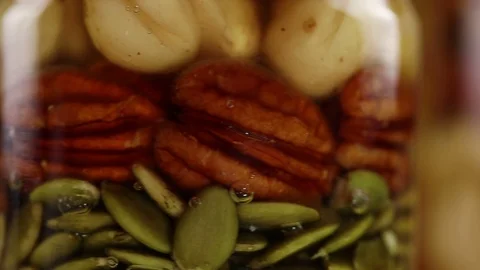 А mixture of nuts and pumpkin seeds Stock Footage 124829768