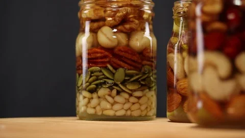 A mixture of nuts and seeds, drenched in honey Stock Footage 124829753