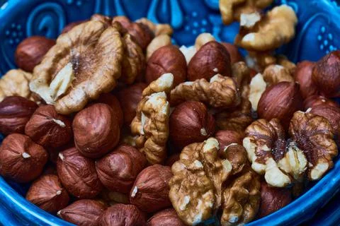 A mixture of nuts in bulk. pistachios almonds hazelnuts walnuts Stock Photos