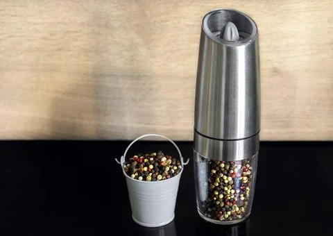 A mixture of pepper varieties in a pepper mill. Heap of various pepper Stock Photos