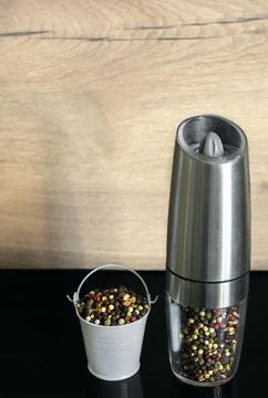 A mixture of pepper varieties in a pepper mill. Heap of various pepper Stock Photos