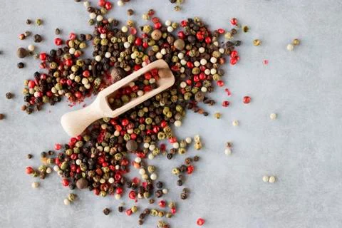 A mixture of peppers on a gray background. Stock Photos