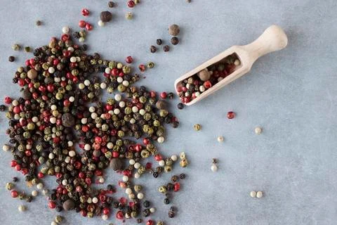 A mixture of peppers on a gray background. Stock Photos