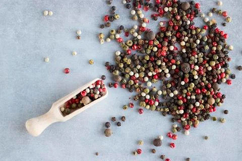 A mixture of peppers on a gray background. Stock Photos