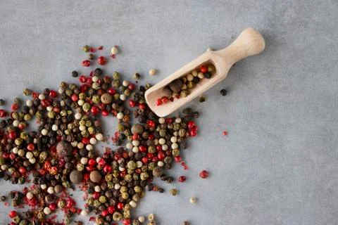 A mixture of peppers on a gray background. Stock Photos