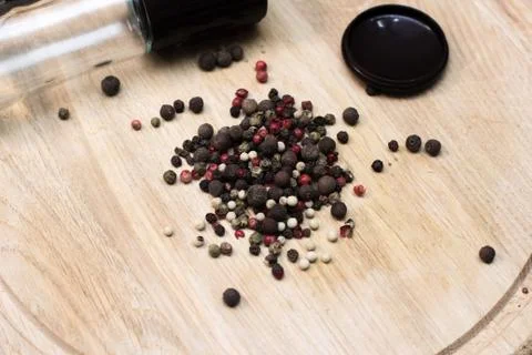 A mixture of peppers on a round board Stock Photos