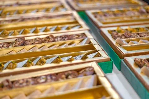 A mixture of various Indian sweets packed in a box. Peda, laddu, mithai, diwa Stock Photos