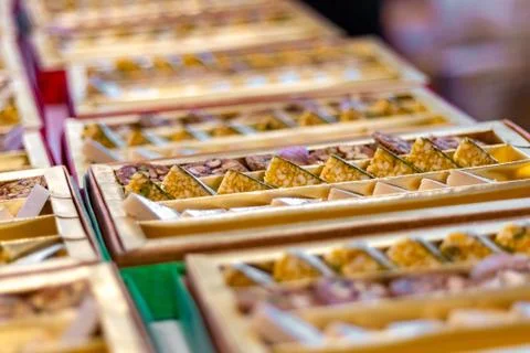 A mixture of various Indian sweets packed in a box. Peda, laddu, mithai, diwa Stock Photos