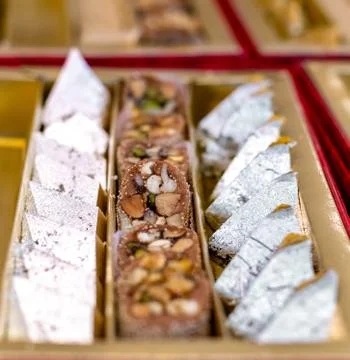 A mixture of various Indian sweets packed in a box. Peda, laddu, mithai, diwa Stock Photos