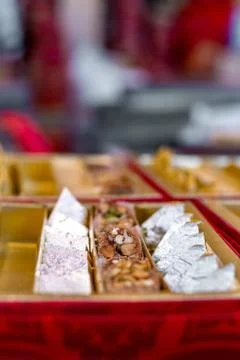 A mixture of various Indian sweets packed in a box. Peda, laddu, mithai, diwa Stock Photos