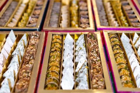 A mixture of various Indian sweets packed in a box. Peda, laddu, mithai, diwa Stock Photos