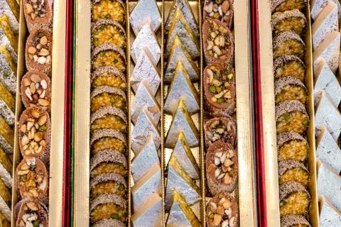 A mixture of various Indian sweets packed in a box. Peda, laddu, mithai, diwa Stock Photos