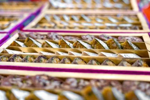A mixture of various Indian sweets packed in a box. Peda, laddu, mithai, diwa Stock Photos
