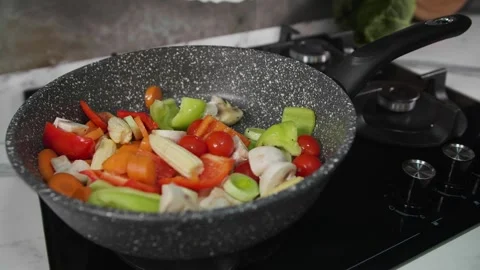 A mixture of vegetables in a frying pan Stock Footage 268576185