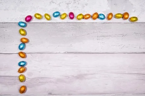 Mixtures of easter eggs of all colors and sizes on a background of old wooden Stock Photos