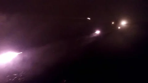 MLRS multiple launch rocket system Grad 21 fires at night. Shooting from a long Stock Footage 233880158