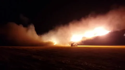 MLRS multiple launch rocket system Grad 21 fires at night. Shooting from a long Stock Footage 233880180