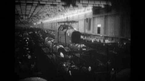 MLS derrick carrying front section of fuselage of B-24 Liberator Stock Footage