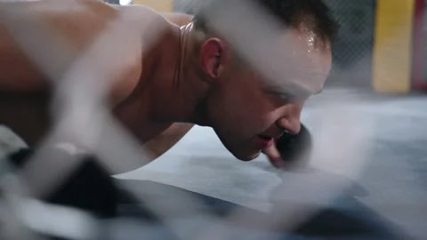 MMA fighter is falling on the floor after being hit and gets up quickly to Stock Footage 155616984