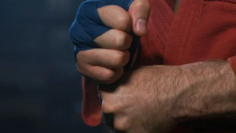 MMA Fighter Prepares For Training. Closeup View Male Wrapping Bandage On Hand Stock Footage 98543603