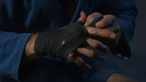 MMA Fighter Preparing For Training. Closeup View Male Wrapping Bandage On Hand Stock Footage 98543623