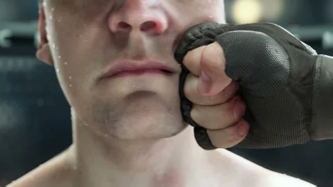 MMA punch, fighter punching hook to the jaw, in super slow motion, highly Stock Footage