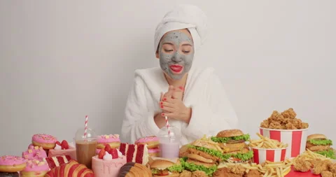 Mmm how delicious. Glad young woman wears bathrobe wrapped towel rubs hands Stock Footage 155489063