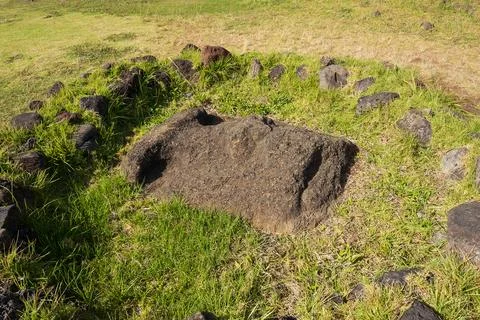 Moai statue with only the face exposed at Ahu Vinapu, Rapa Nui National Par.. Stock Photos