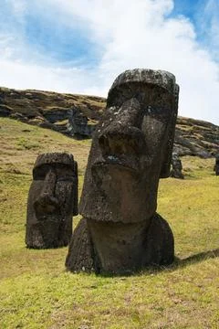The moai statues standing on the slopes of Rano Raraku. Stock Photos