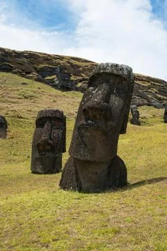 The moai statues standing on the slopes of Rano Raraku Stock Photos