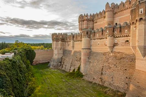 Moat and partial view of the walls of the castle of Coca Gothic style Mudejar Stock Photos