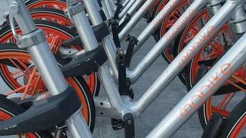 Mobike bicycles parked waiting to be rented in 4k Stock Footage 94137900