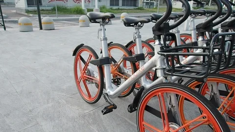 Mobike bicycles parked waiting to be rented in 4k Stock Footage 94137975